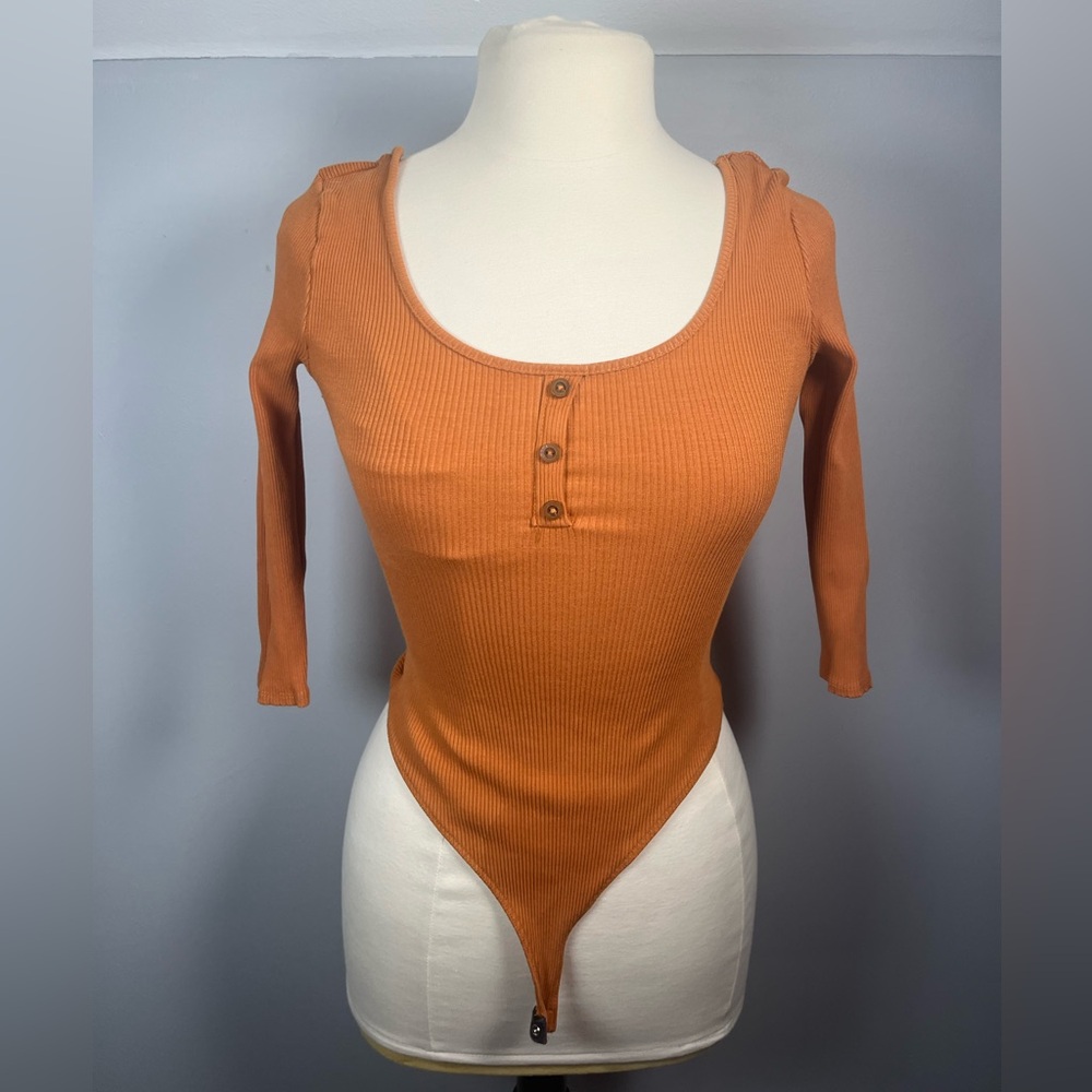 Charlotte Russe burnt orange long sleeved body suit